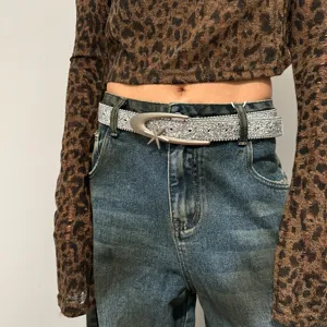 Women's silver glitter waist belt with unique star metal buckle, trendy Y2K fashion accessory.
