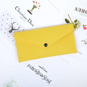 Top view of a bright yellow felt multi-functional storage pouch with a snap button.