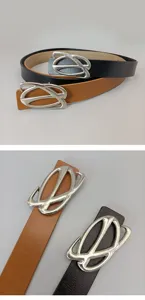 Close-up detail view of women's leather belt featuring unique silver metal buckle.