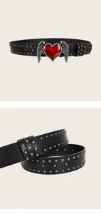 Y2K black leather belt with metal studs and vintage winged red heart buckle detail shot.