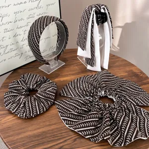 Set of brown striped sequin hair accessories including headband, scrunchies and claw clip