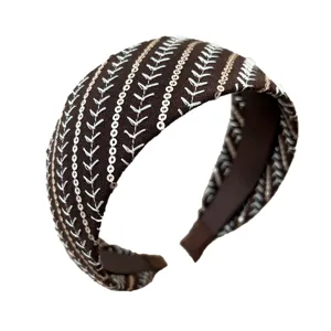 Wide brown headband with elegant sequin stripes and white embroidery for women
