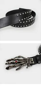 Punk style black leather belt with metal studs and gothic skeleton hand buckle with red gem.