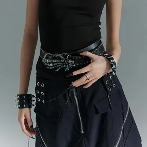 Gothic punk black leather belt with skeleton hand buckle and metal rivets for rocker style.