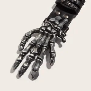 Goth punk black leather belt featuring a detailed silver skeleton hand buckle with rhinestone accent.