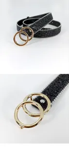 Close-up detail showing the women's black glitter belt with gold double round rings.
