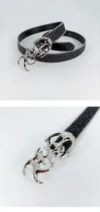 Y2K cyberpunk style women's black glitter belt featuring unique silver cut-out metal buckle.