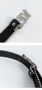 Close-up detail of women's black belt featuring silver ball-chain trim and gothic letter buckle.