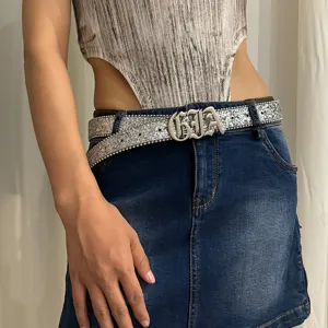 Silver sequin waist belt for women, stylish metallic letter buckle accessory for jeans.