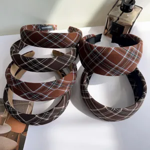 Close-up of retro plaid padded headbands in brown and dark chocolate colors