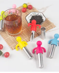 Silicone and stainless steel little man tea infuser detail shot, colorful novelty kitchen tool.