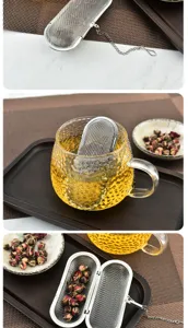 Stainless steel tea infuser with fine mesh chain for loose leaf tea and herbal brewing.