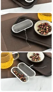 Stainless steel rectangular tea infuser detail view, fine mesh filter with chain for loose leaf tea.