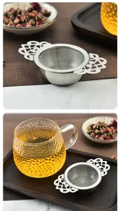 Detailed view of stainless steel tea strainer featuring fine mesh and elegant lace handles.