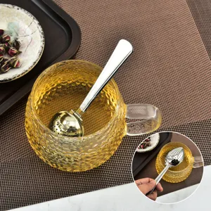 Stainless steel tea infuser with long handle and mesh ball filter for loose leaf tea brewing