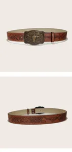 Vintage Western cowboy leather belt with detailed bull head metal buckle and embossed strap design.