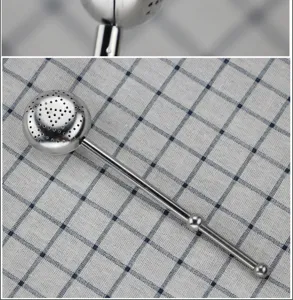 Detailed close-up shot of the stainless steel tea infuser mesh ball and long handle.