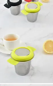 Stainless steel tea infuser with silicone handle and lid, perfect for loose leaf tea filtering.