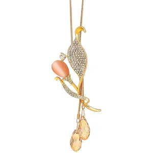 Elegant gold-tone crystal sweater chain necklace featuring a peach cat-eye stone