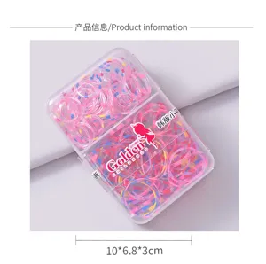 Macro shot of colorful patterned elastic hair bands in a clear plastic storage box