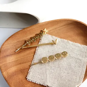 Gold metal heart star and smiley face hairpins for women in Korean minimalist style.