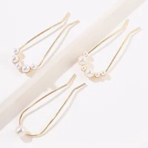 Detail view showing three elegant gold U-shaped hairpins with white pearls for Hanfu