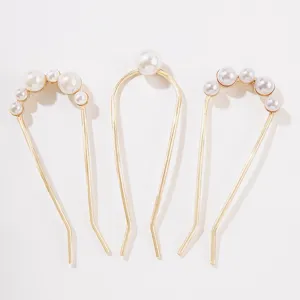 Elegant gold U-shaped hairpins set with white pearls for traditional hairstyles
