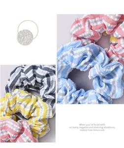 Detailed macro view of colorful striped fabric scrunchies with soft seersucker texture