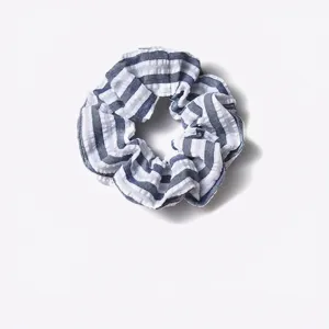 Minimalist blue and white striped fabric scrunchie hair tie for women stylish accessory