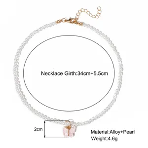 Détail du collier de perles papillon avec spécifications de taille et matière