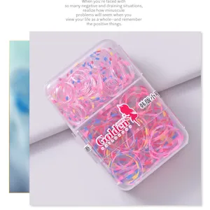 Detailed view of colorful striped hair ties in a clear plastic storage box for girls