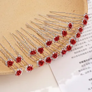 Set of elegant red rose U-shaped hairpins with sparkling rhinestones for hair styling.