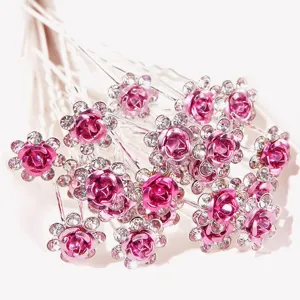 Elegant pink rose U-shaped hairpins with sparkling rhinestones for bridal hair styling