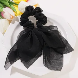 Élastique à cheveux chic en mousseline noire avec ruban pour queue de cheval française.
