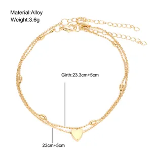 Detail view of double-layer gold heart anklet with material and girth specifications