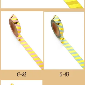 Close-up detail of metallic gold foil striped washi tape showing color variants G-82 and G-83.