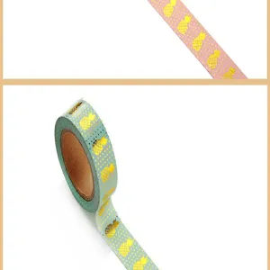 Ruban adhésif décoratif washi avec motif d'ananas doré pour carnet et loisirs créatifs.