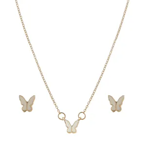 Detail view of a vintage butterfly jewelry set including a pendant necklace and stud earrings.