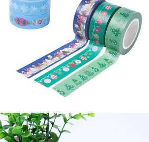 Christmas washi tape detail showing festive patterns like snow trees and ornaments for journals.