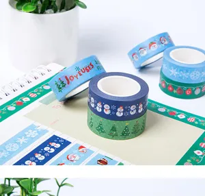 Christmas washi tape set detail view, featuring cute snowman and tree patterns for journal decorating.