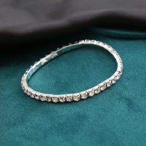 Close-up of elegant single-row rhinestone tennis bracelet with elastic band design
