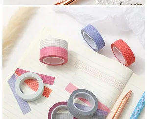 Grid washi tape close up, showing clean plaid patterns and adhesive texture for journaling.