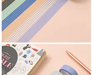 Grid washi tape detail shot showing colorful square patterns for journal decoration and crafts.
