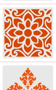 Close up detail of orange and white mandala painting stencil template for DIY craft and art project.