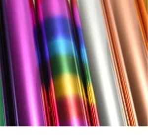 Colorful hot stamping foil rolls for DIY crafts, shiny metallic transfer paper detail view.