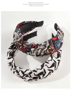 Detailed view of Halloween knotted headbands with wizard hat and skull patterns