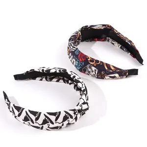 Set of Halloween knotted headbands featuring wizard hat and colorful rose skull prints