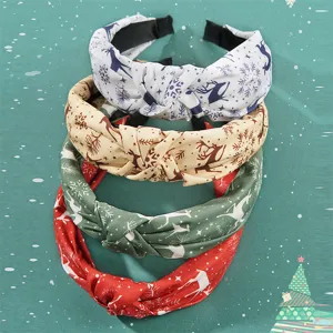 Set of 4 Christmas knotted cloth headbands with festive reindeer and snowflake patterns.