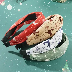 Festive Christmas fabric headbands with reindeer and snowflake patterns in 4 colors.