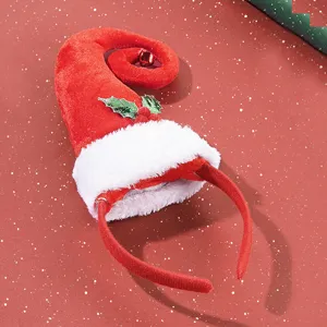 Festive red elf hat headband with white plush trim and green holly leaf decoration